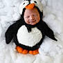 Grayson joined the competition — help win amazing prizes! baby, penguin_costume, sleeping, cute, fluffy, soft, white_background, orange_beak, orange_feet, newborn, infant, costume, adorable, portrait, cozy, child, smiling, furry, animal_outfit, warm