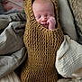 Grayson joined the competition — help win amazing prizes! baby, sleeping, knitted, bear_costume, blanket, cushion, cozy, cute, infant, wrapped, soft, warm, child, face, head, hand, resting, indoors, comfort, portrait