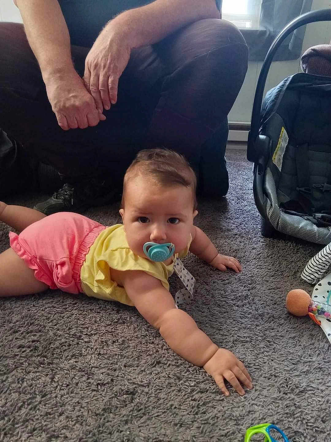 Elisa is registered to the contest to win money with this photo: adult, baby, babycrawling, clothing, couch, crawling, cushion, face, furniture, head, homedecor, male, man, pants, person, photography, portrait, shorts, sitting, t_shirt