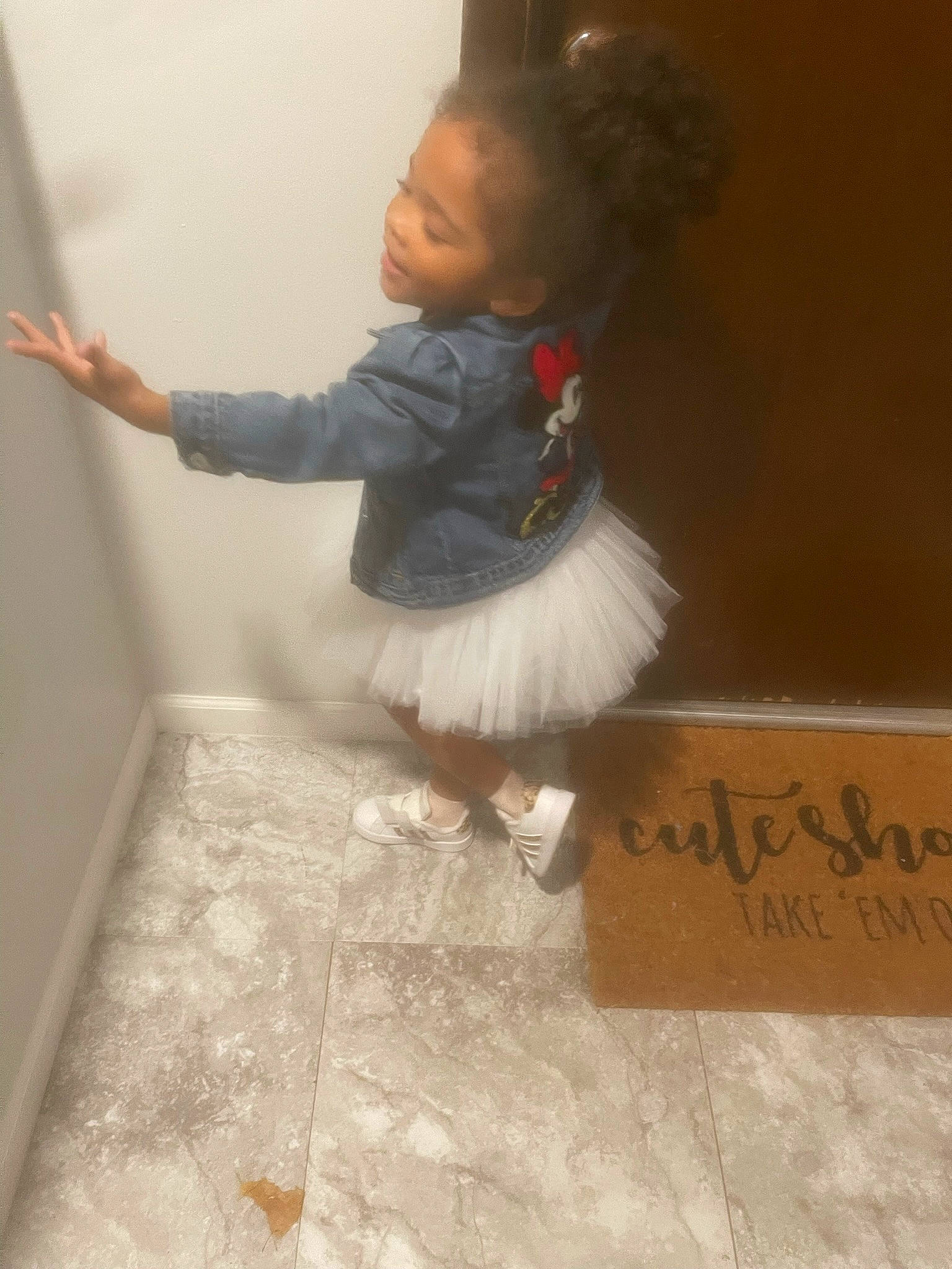 Ximenna is registered to the contest to win money with this photo: baby, baby_toddler_clothing, brown, child, floor, flooring, font, foot, fur, gesture, happy, hardwood, human_leg, paper_product, pattern, person, room, sleeve, sock, toddler