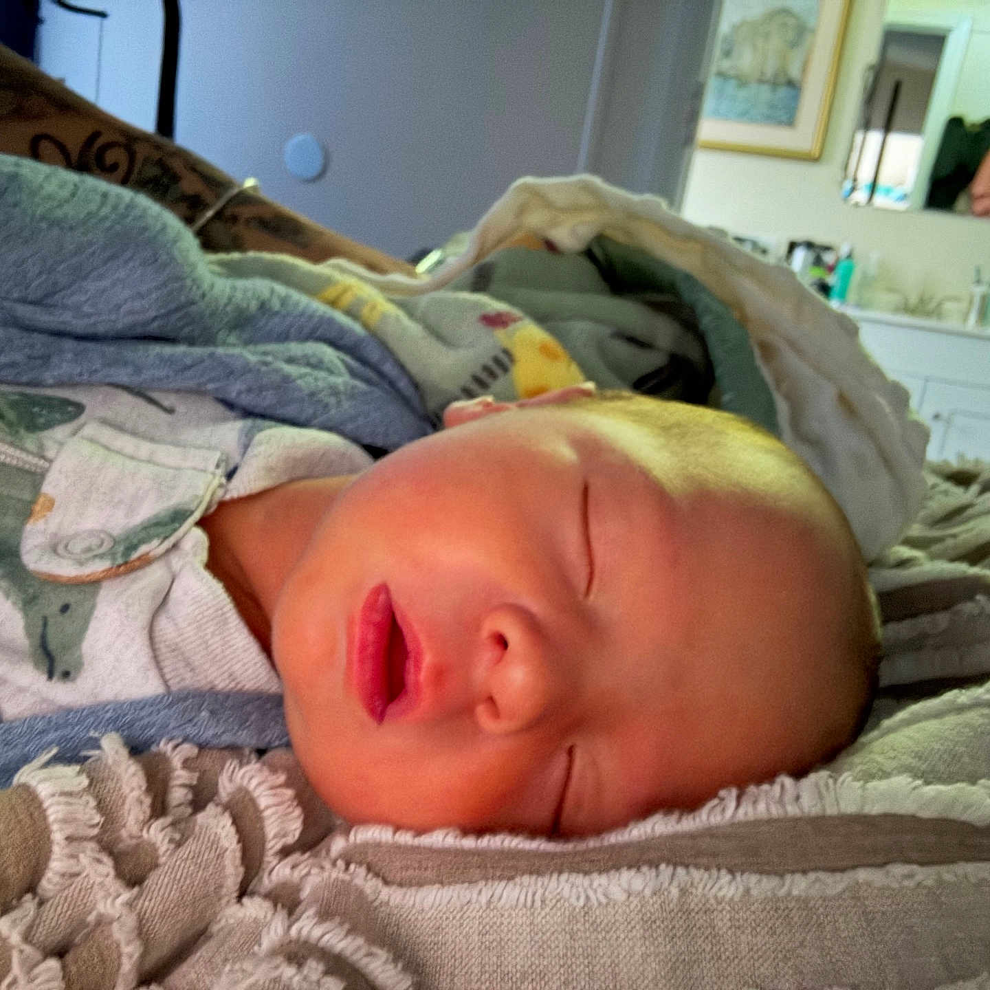 Zayden Thaddeus is registered to the contest to win money with this photo: baby, bedspread, blanket, closeup, clothing, comfort, cozy, fabric, face, home, indoor, infant, newborn, peaceful, person, portrait, resting, sleeping, soft_light, towel