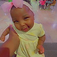 Journee joined the competition — help win amazing prizes! toddler, child, pink_bow, yellow_dress, smile, indoor, people, group, table, sitting, floor, hand, arm, headband, happy, cute, baby, portrait, childcare, playful