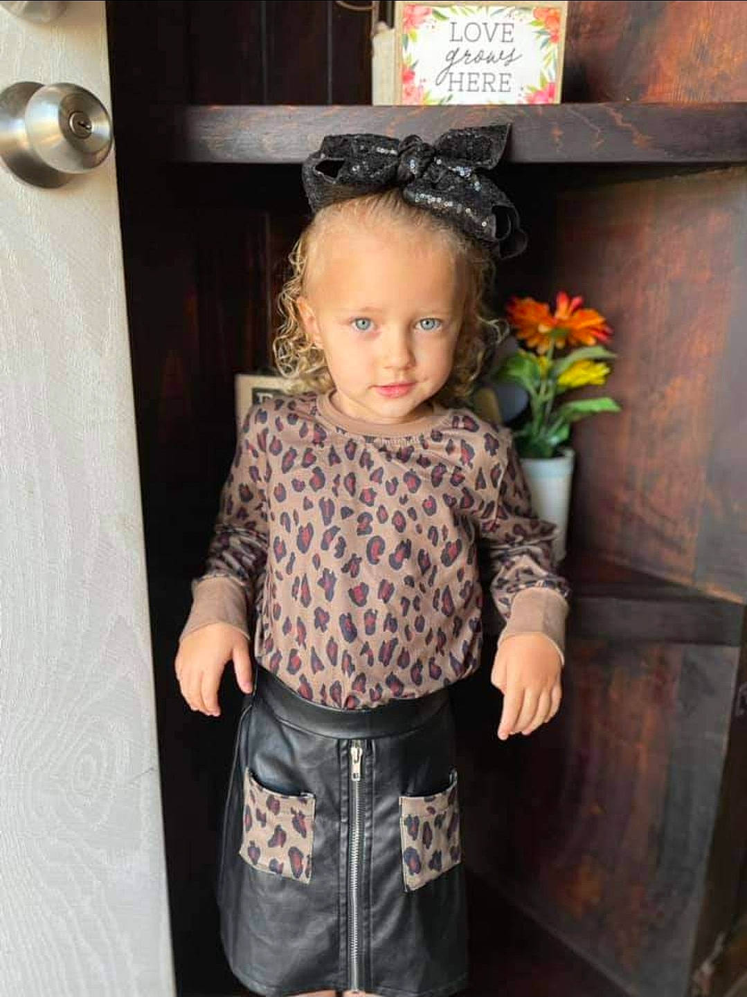 Tynsleigh is registered to the contest to win money with this photo: baby, baby_products, baby_toddler_clothing, child, costume, door, flower, flower_arranging, flowerpot, formal_wear, happy, pattern, person, plant, room, sitting, sleeve, t_shirt, toddler, waist