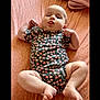 Emersyn is registered to the contest to win money with this photo: adorable, arms, baby, baby_rolls, child, cute, expression, fists, floral_onesie, head, indoors, infant, legs, lying_down, patterned_bedding, pink_sheet, playful, skin, soft_lighting, tongue_out