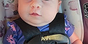 Emersyn joined the competition — help win amazing prizes! baby, car_seat, child, close_up, cute, eyes, face, floral_pattern, head, indoors, infant, looking_up, person, purple_clothing, restraint, safety_harness, seat_belt, small_hand, straps, young_child