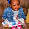 toddler, child, baby, denim_jacket, dress, socks, pigtails, bows, couch, indoor, smiling, cute, colorful, portrait, sitting, person, happy, fashion, clothing, young_child