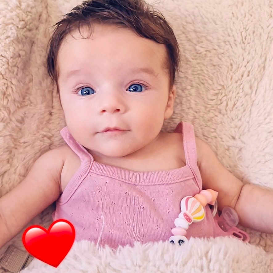 Giorgia participe au concours pour gagner de l'argent avec cette photo : baby, blanket, blue_eyes, child, closeup, comfort, cozy, cute, expression, face, hair, heart_emoji, indoors, infant, lying_down, pacifier, pink_clothing, portrait, skin, soft_texture