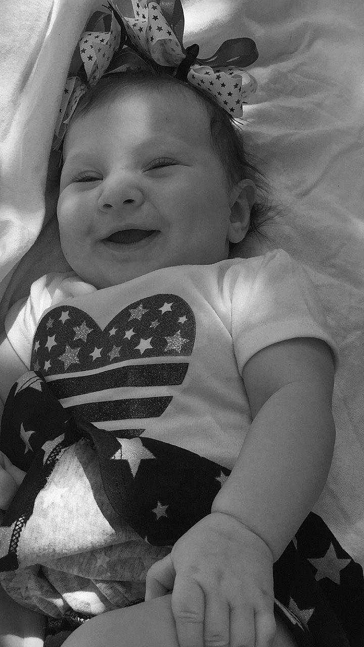 Christina is registered to the contest to win money with this photo: arm, baby, black, black_and_white, cheek, child, eye, face, facial_expression, happy, head, lip, monochrome, monochrome_photography, nose, people, person, skin, smile, toddler