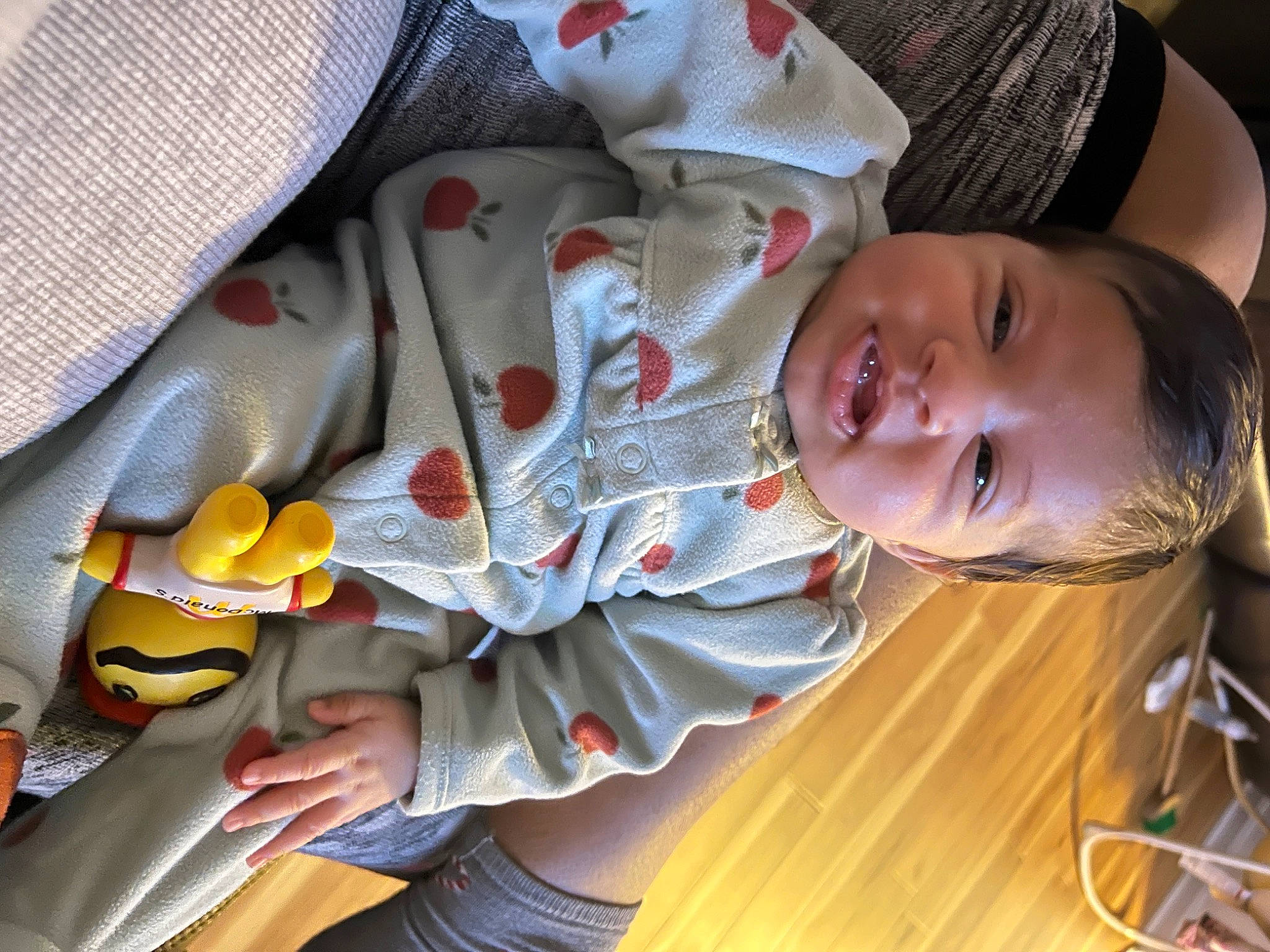 Maria Byas is registered to the contest to win money with this photo: baby, baby_products, baby_toddler_clothing, carmine, child, comfort, flooring, happy, hardwood, headgear, mammal, mouth, pattern, person, skin, sleeve, smile, toddler, vertebrate, white