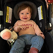 Juniper joined the competition — help win amazing prizes! baby, smiling, car_seat, plush_toy, cow_toy, turtle_toy, child, clothing, blue_pants, pink_socks, happy, infant, person, cute, indoor, seat, head_support, warning_label, soft_toy, casual