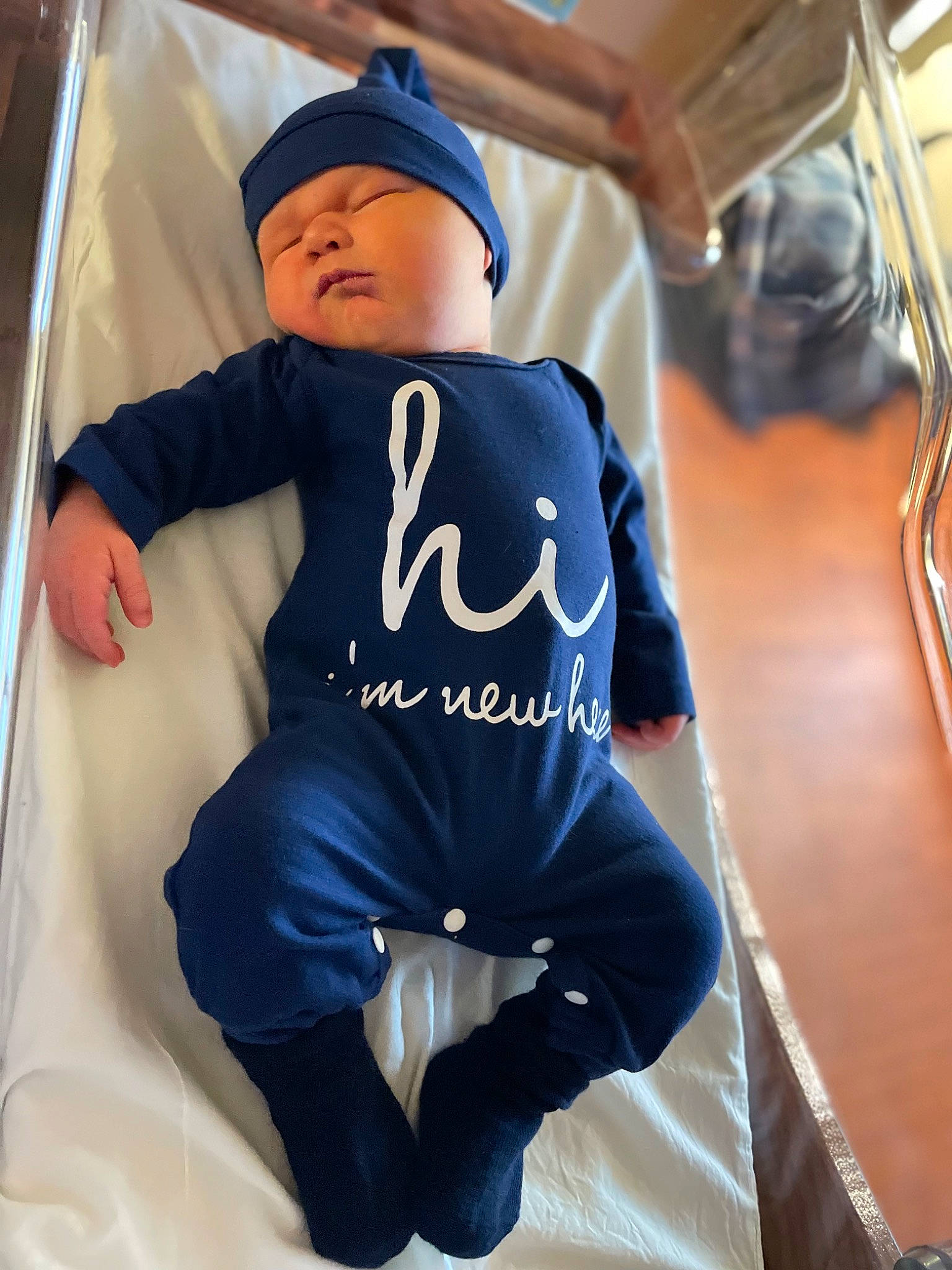 Kolt is registered to the contest to win money with this photo: baby, baby_products, baby_toddler_clothing, bag, baseball_cap, cap, cool, electric_blue, font, hat, headwear, jersey, person, personal_protective_equipment, sitting, sleeve, sports_gear, sportswear, t_shirt, thigh