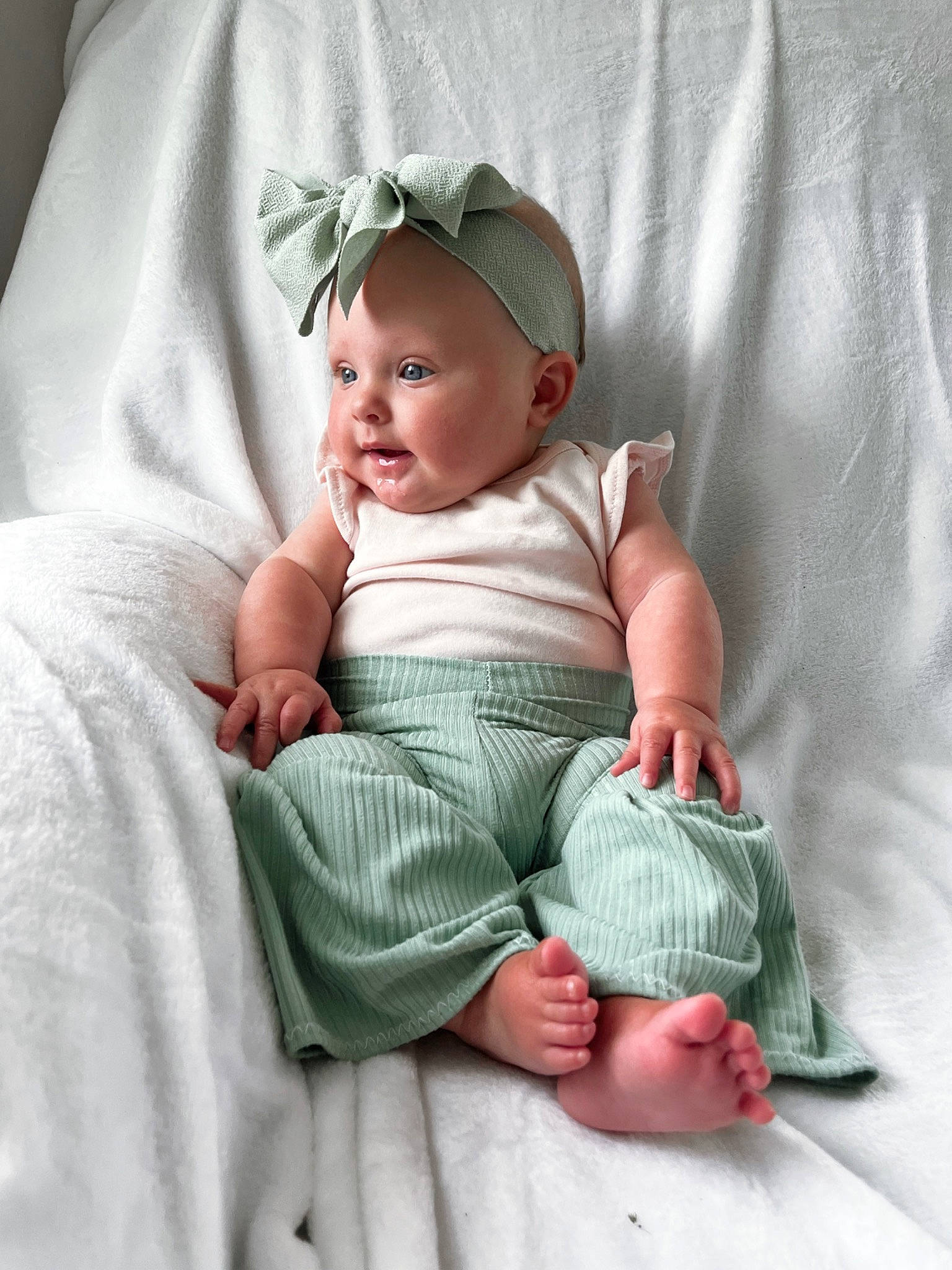 Lucy joined the competition — help win amazing prizes! baby, baby_products, baby_sleeping, baby_toddler_clothing, barefoot, cheek, child, chin, comfort, eye, face, foot, head, linens, pattern, person, portrait_photography, sitting, skin, sleeve