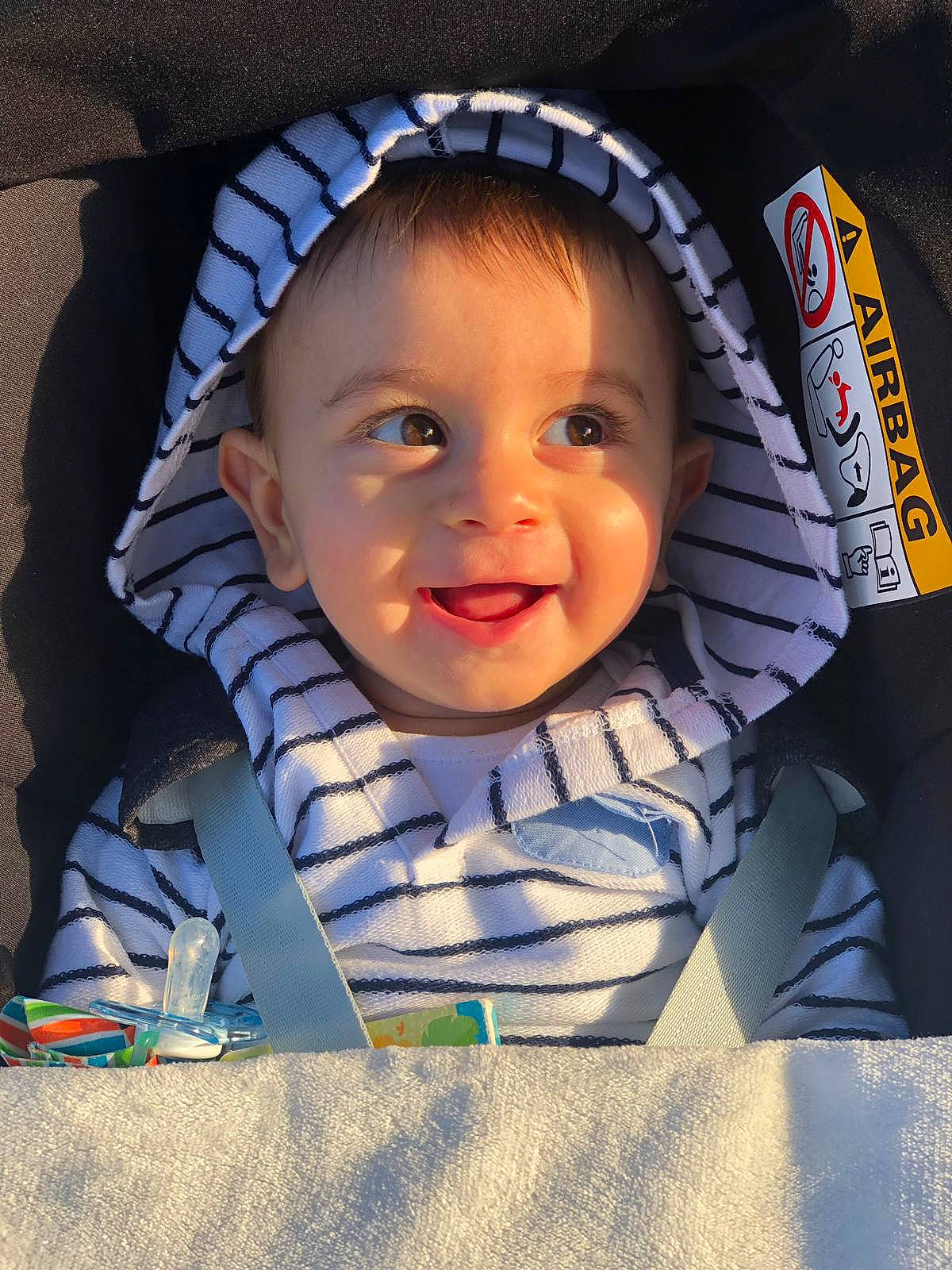 Harris is registered to the contest to win money with this photo: baby, cheek, child, chin, cool, eye, face, facial_expression, forehead, happy, head, headgear, joy, lip, nose, person, play, product, skin, smile