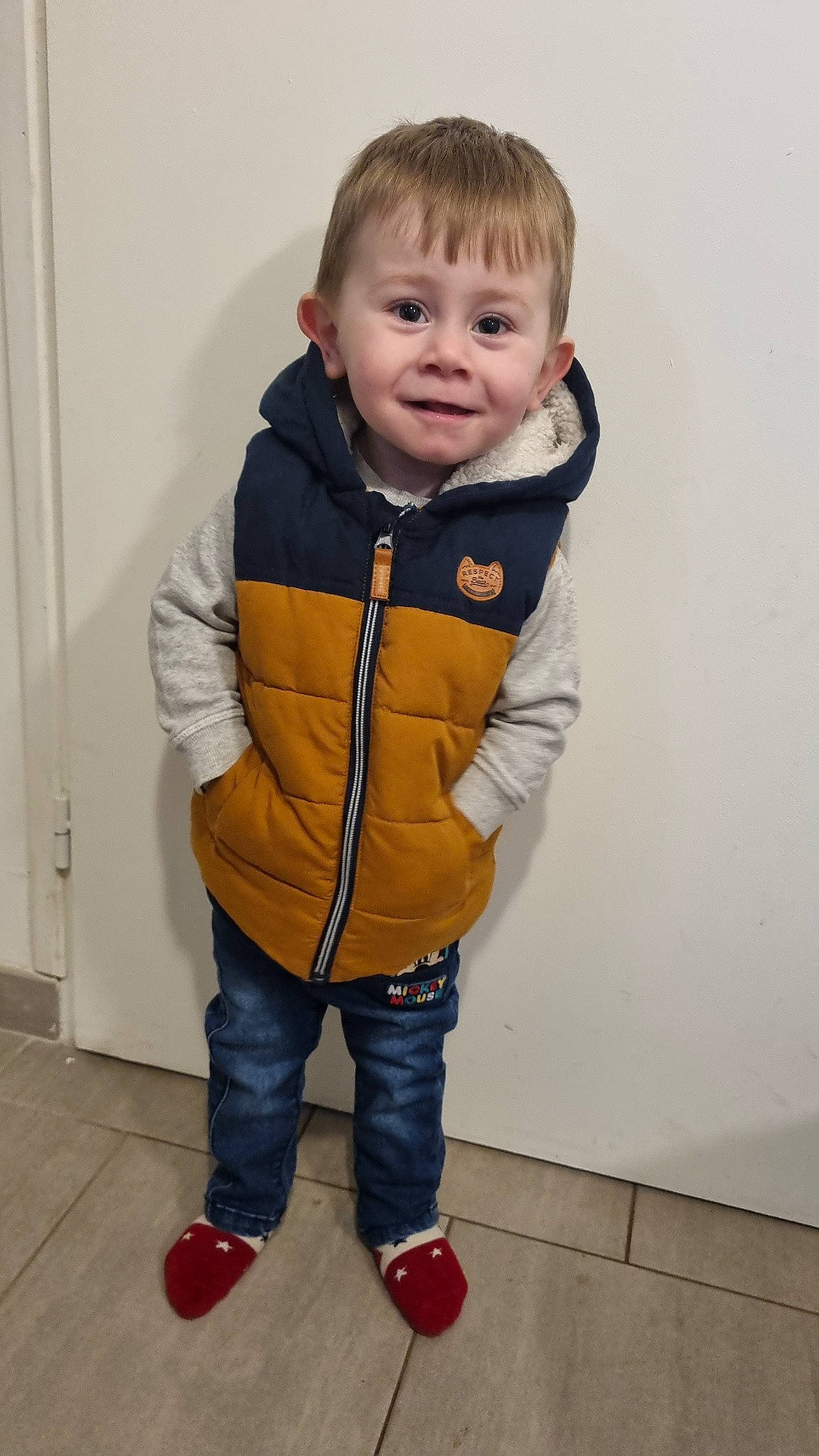 Kenzo participe au concours pour gagner de l'argent avec cette photo : baby, baby_toddler_clothing, cheek, child, collar, electric_blue, eye, face, flooring, fur, hair, happy, jacket, joy, nose, person, skin, sleeve, smile, standing