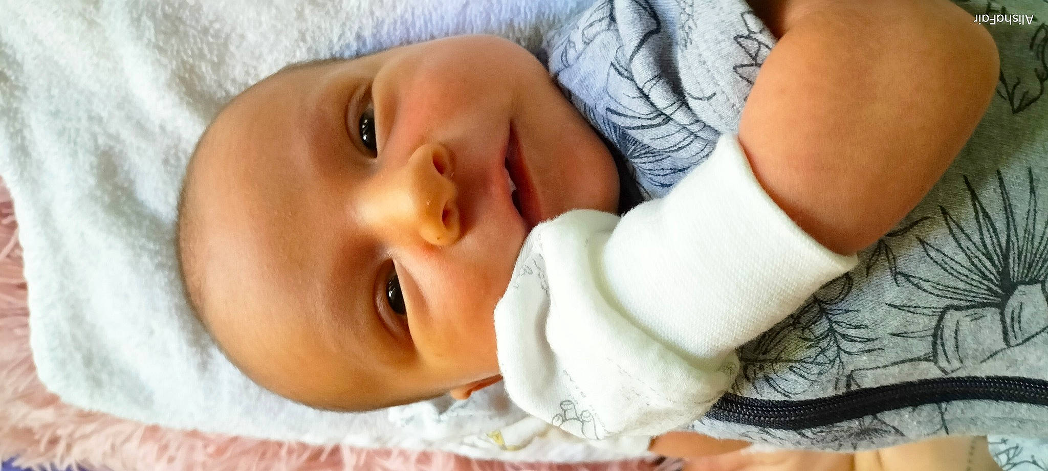 Kaidyn is registered to the contest to win money with this photo: baby, baby_toddler_clothing, cheek, comfort, eye, eyebrow, eyelash, facial_expression, finger, gesture, hand, human, iris, lip, mammal, mouth, nose, person, product, skin