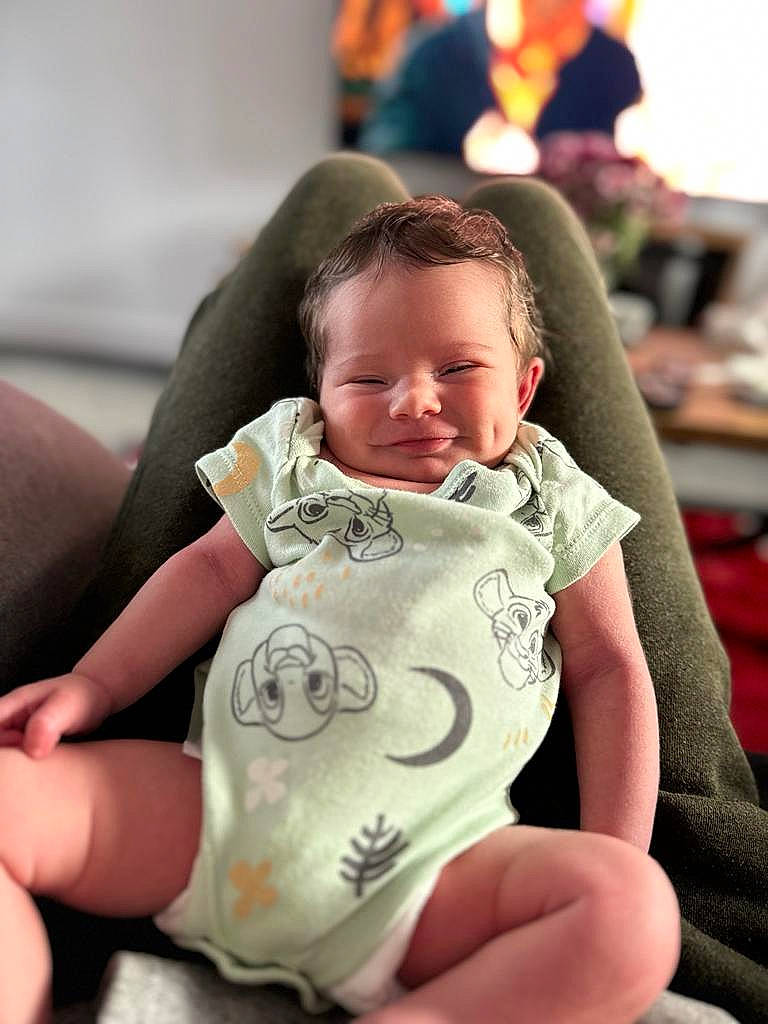 Harrison joined the competition — help win amazing prizes! baby, baby_toddler_clothing, bib, cheek, child, comfort, dress, face, finger, fun, gesture, hairstyle, happy, head, person, sitting, skin, sleeve, smile, thumb