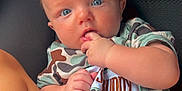 Beau Sego joined the competition — help win amazing prizes! baby, infant, child, onesie, camouflage, blue_eyes, fingers, cute, sitting, car_seat, legs, skin, expression, clothing, person, portrait, indoor, comfort, young, closeup