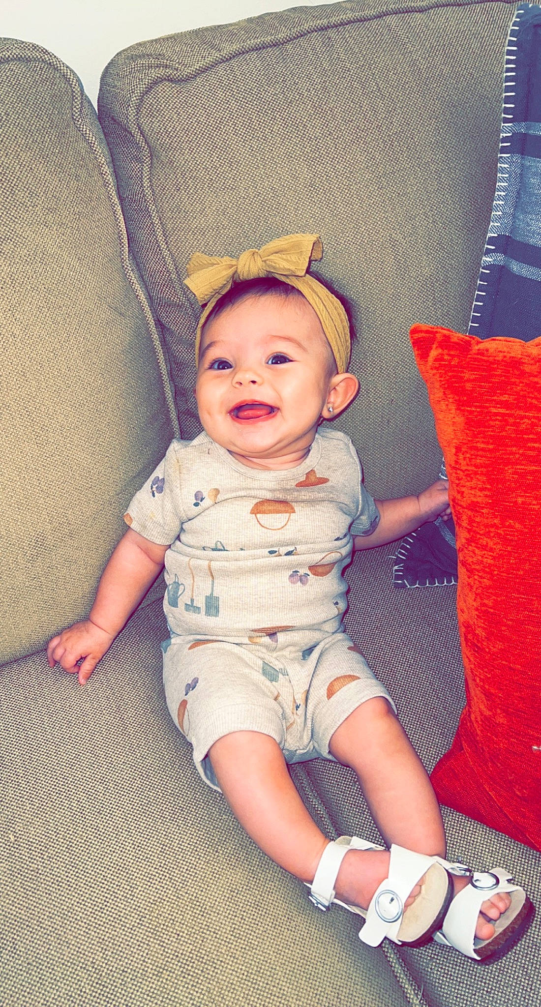 Blakely joined the competition — help win amazing prizes! baby, baby_toddler_clothing, cheek, child, comfort, foot, fun, happy, human_leg, iris, knee, leg, lip, pattern, person, sitting, skin, sleeve, smile, thigh