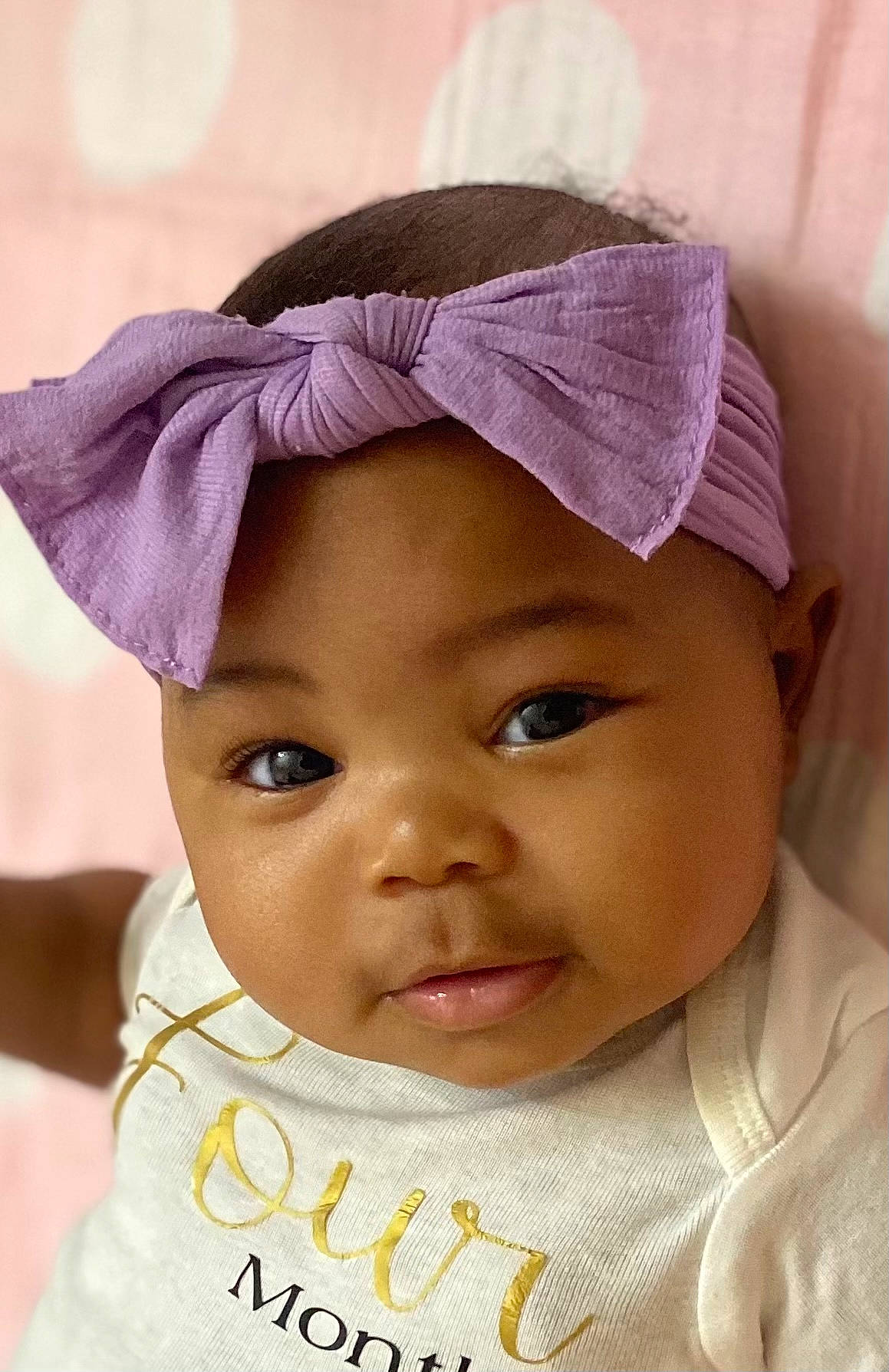 Kadence is registered to the contest to win money with this photo: cheek, chin, eye, eyebrow, eyelash, face, happy, headgear, headwear, human, iris, lip, mouth, neck, nose, person, pink, purple, skin, sleeve