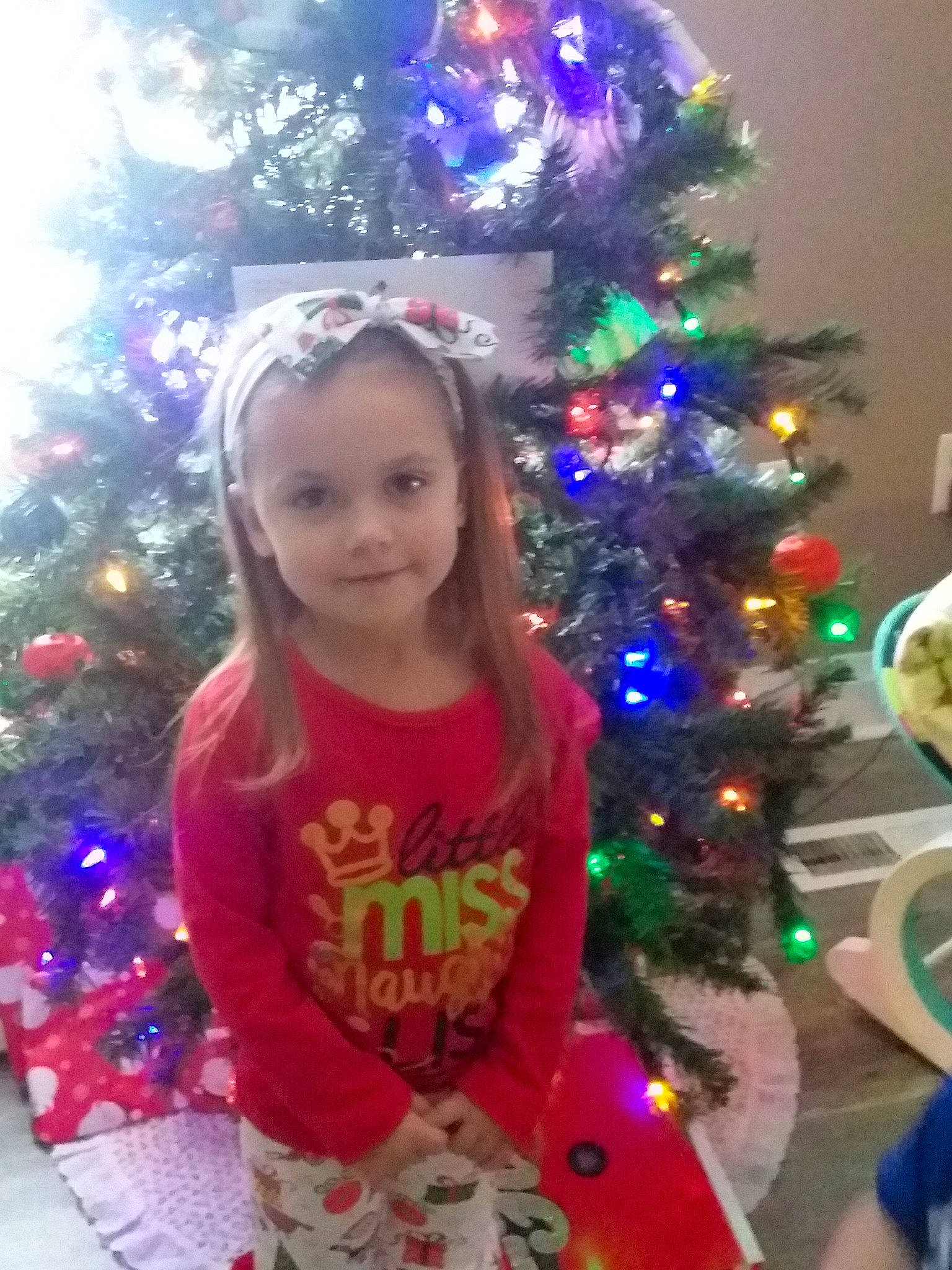 Izzy is registered to the contest to win money with this photo: child, christmas, christmas_decoration, christmas_eve, christmas_lights, christmas_ornament, christmas_tree, conifer, event, fir, holiday, holiday_ornament, interior_design, ornament, person, pine, pine_family, plant, smile, toddler