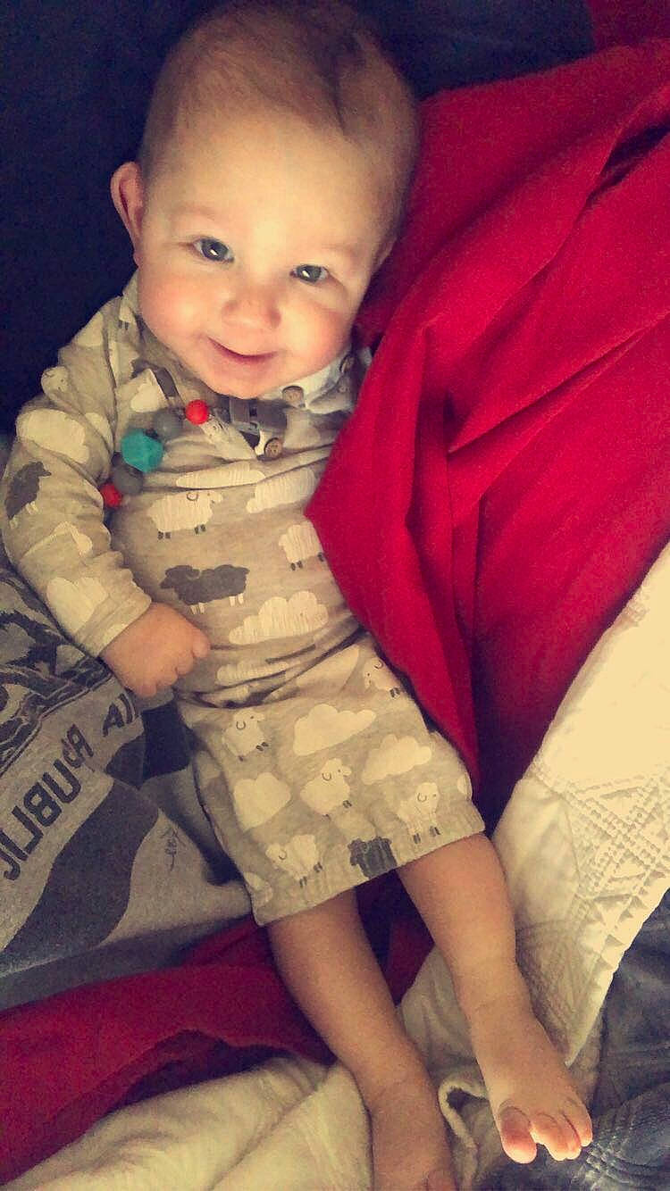 Kaysen is registered to the contest to win money with this photo: arm, baby, cheek, child, eye, lip, nose, person, sitting, skin, smile, toddler