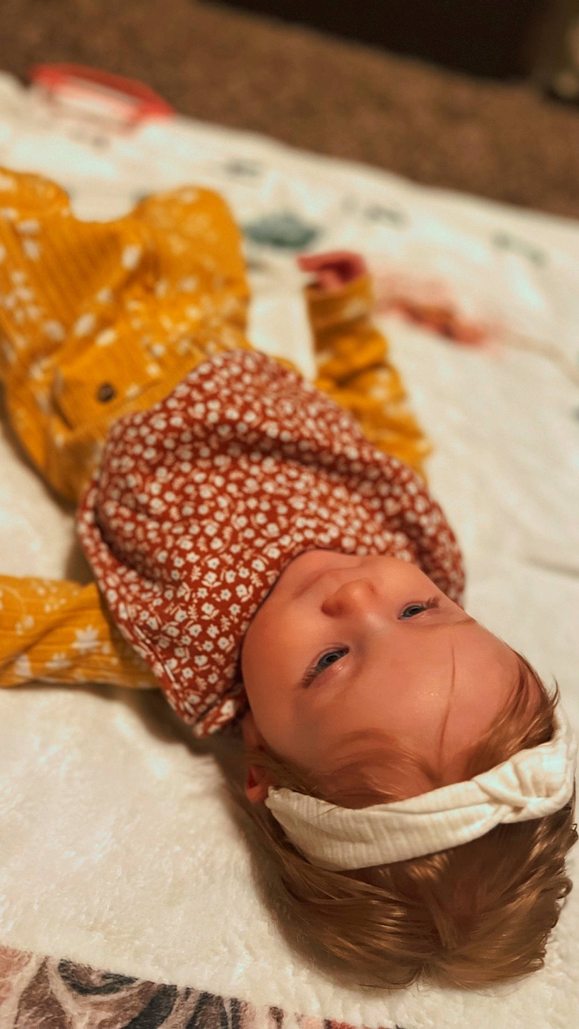 Harlynn joined the competition — help win amazing prizes! baby, baby_sleeping, baby_toddler_clothing, beanie, child, comfort, costume_hat, crochet, eye, fashion_accessory, fur, happy, knit_cap, linens, pattern, peach, person, textile, toddler, wood