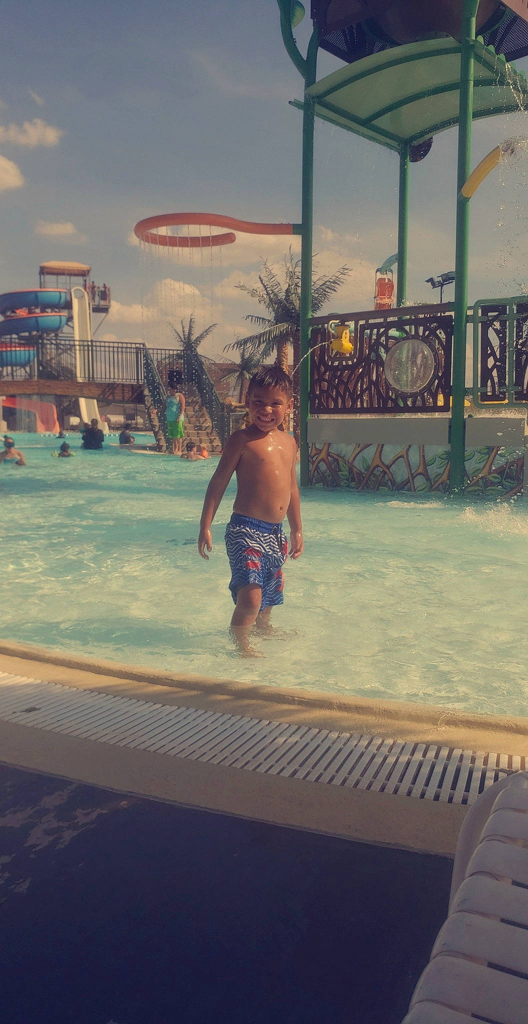 Corey James is registered to the contest to win money with this photo: amusement_park, child, fun, games, joy, leisure, nonbuilding_structure, park, person, recreation, sky, summer, swimming_pool, vacation, water, water_park, world