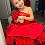 blue_eyes, child, clothing, cute, dress, fashion, floor, girl, happy, home, indoor, long_hair, person, playful, portrait, red_dress, room, smiling, standing, tulle