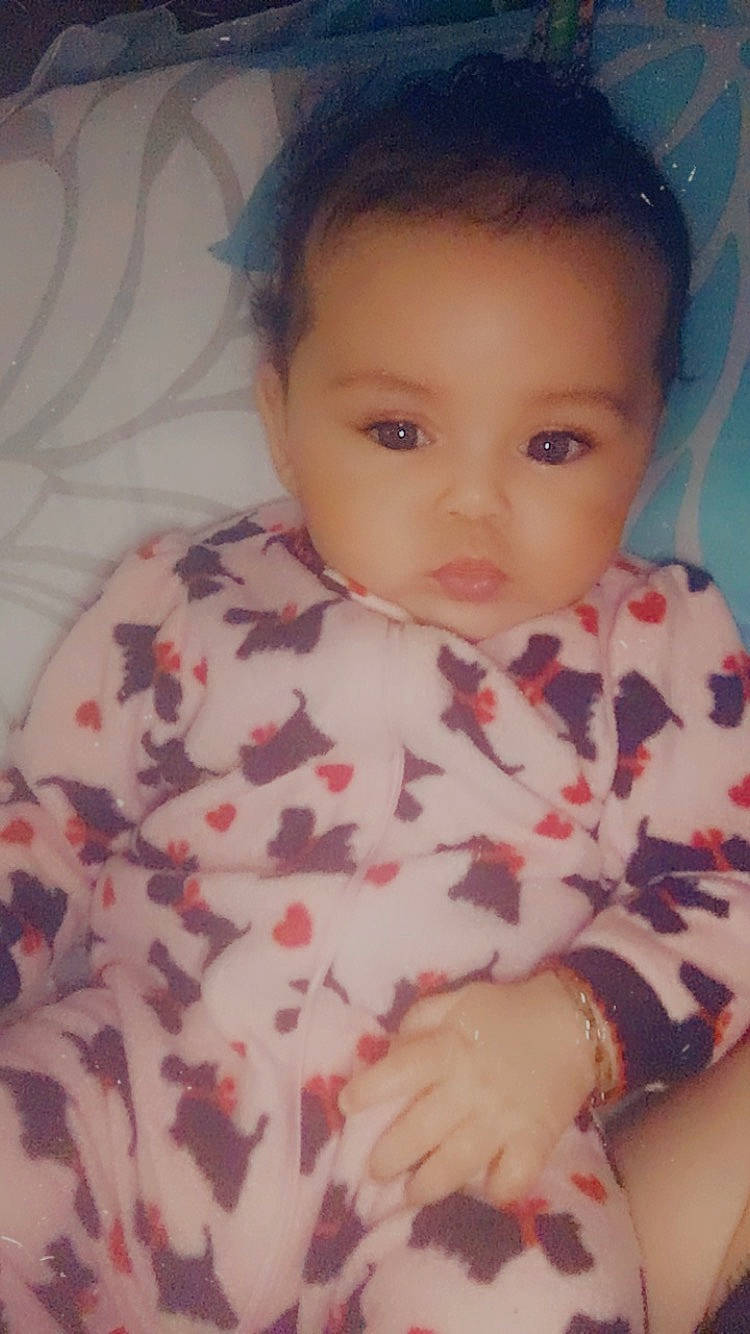 Shanelle is registered to the contest to win money with this photo: baby, baby_toddler_clothing, cheek, chin, ear, eyebrow, eyelash, facial_expression, forehead, hair, headgear, iris, lip, neck, nose, person, pink, skin, sleeve, textile