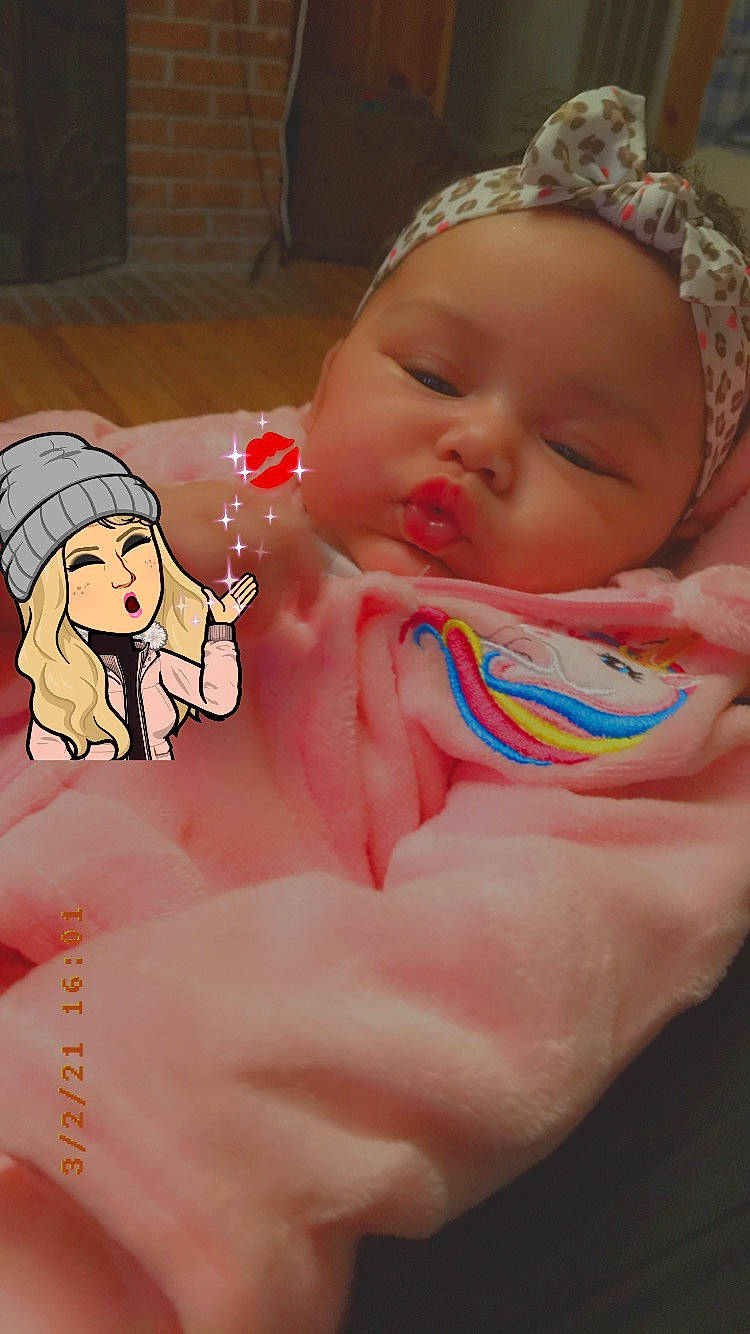 Shanelle is registered to the contest to win money with this photo: arm, baby, baby_toddler_clothing, cheek, facial_expression, finger, gesture, hand, head, human_body, lip, mouth, muscle, neck, nose, person, pink, product, skin, thumb