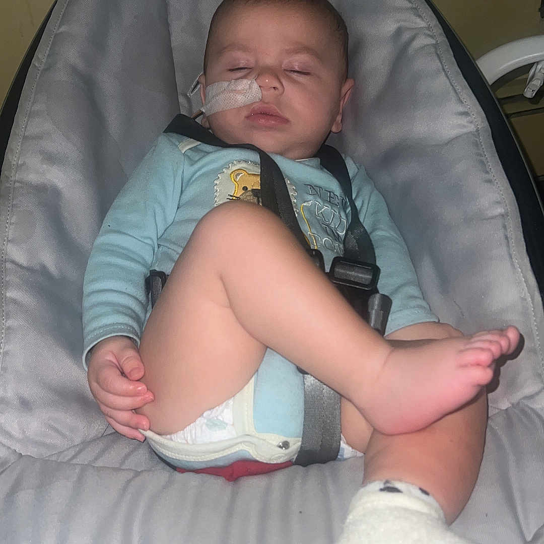 Matthew is registered to the contest to win money with this photo: baby, bed, bodypart, clothing, cushion, diaper, face, finger, footwear, furniture, hand, head, homedecor, hosiery, person, photography, portrait, shoe, shorts, sock
