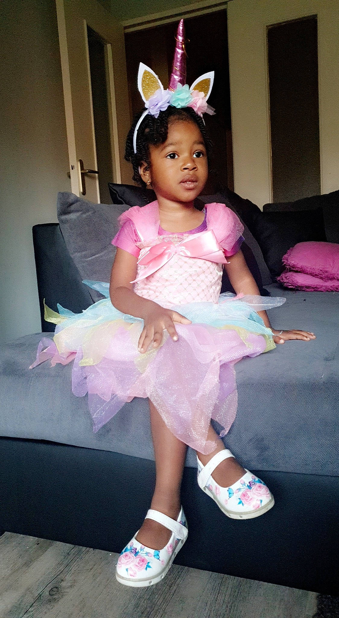 Fatoumata participe au concours pour gagner de l'argent avec cette photo : baby_toddler_clothing, ballet_tutu, costume, embellishment, event, fashion_design, happy, headband, headgear, headpiece, jewellery, magenta, mythical_creature, person, pink, purple, ruffle, sock, textile, toddler