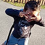 Brayton participe au concours pour gagner de l'argent avec cette photo : child, boy, playful, backpack, t_shirt, shorts, sneakers, spiky_hair, hand_gesture, sidewalk, fence, outdoor, sunny, shadow, portrait, candid, smile, playful_pose, asphalt, casual_clothing