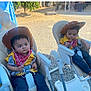 Joel-Jerimiah joined the competition — help win amazing prizes! child, toddler, cowboy_hat, bandana, high_chair, yellow_shirt, jeans, outdoor, balloons, gravel, costume, baby, person, footwear, hat, seat, cute, event, celebration, sunlight