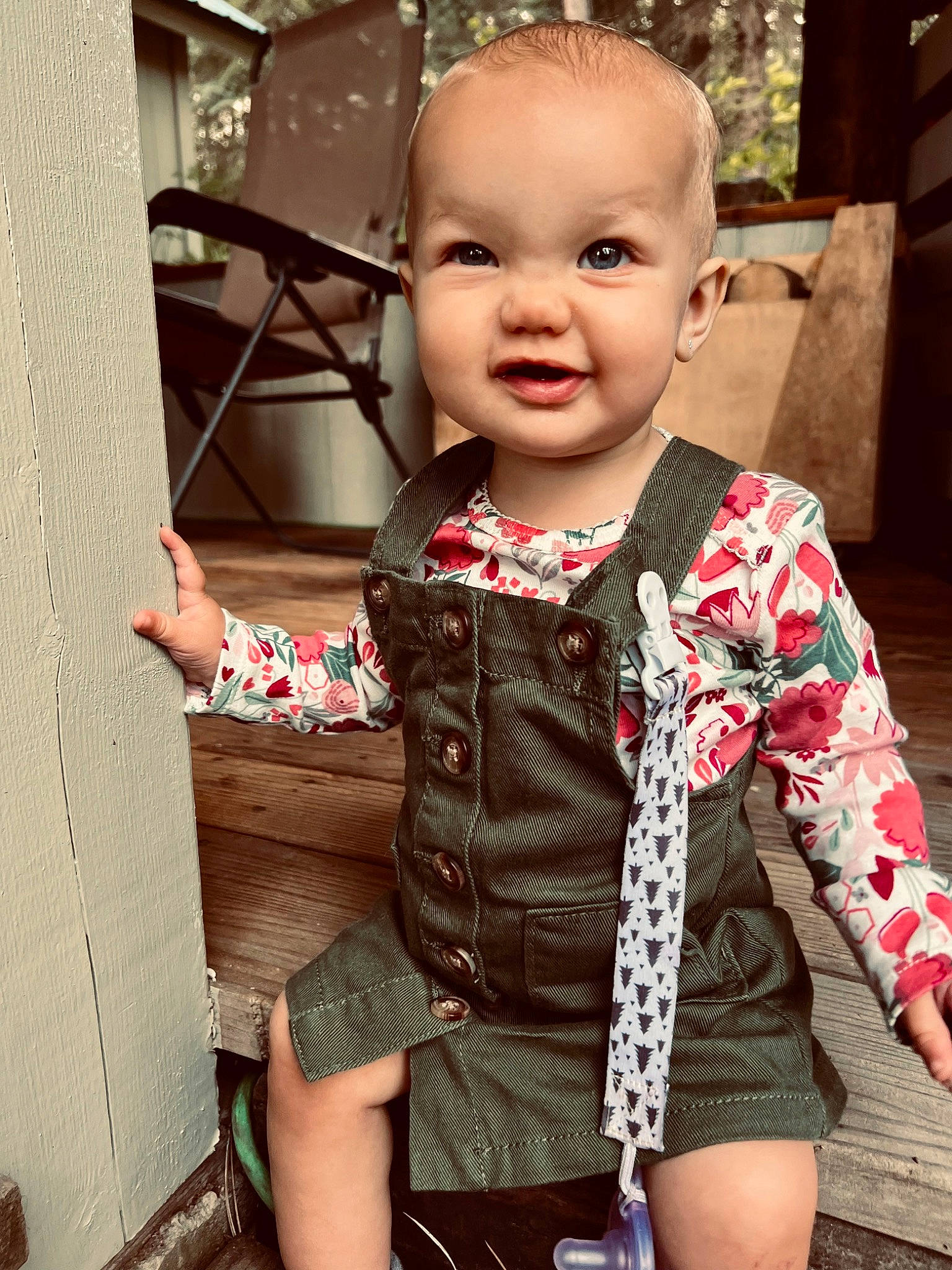 Huntleigh is registered to the contest to win money with this photo: baby, baby_toddler_clothing, blond, cheek, chin, collar, cool, eyelash, happy, iris, neck, nose, pattern, person, pink, sitting, skin, sleeve, smile, t_shirt