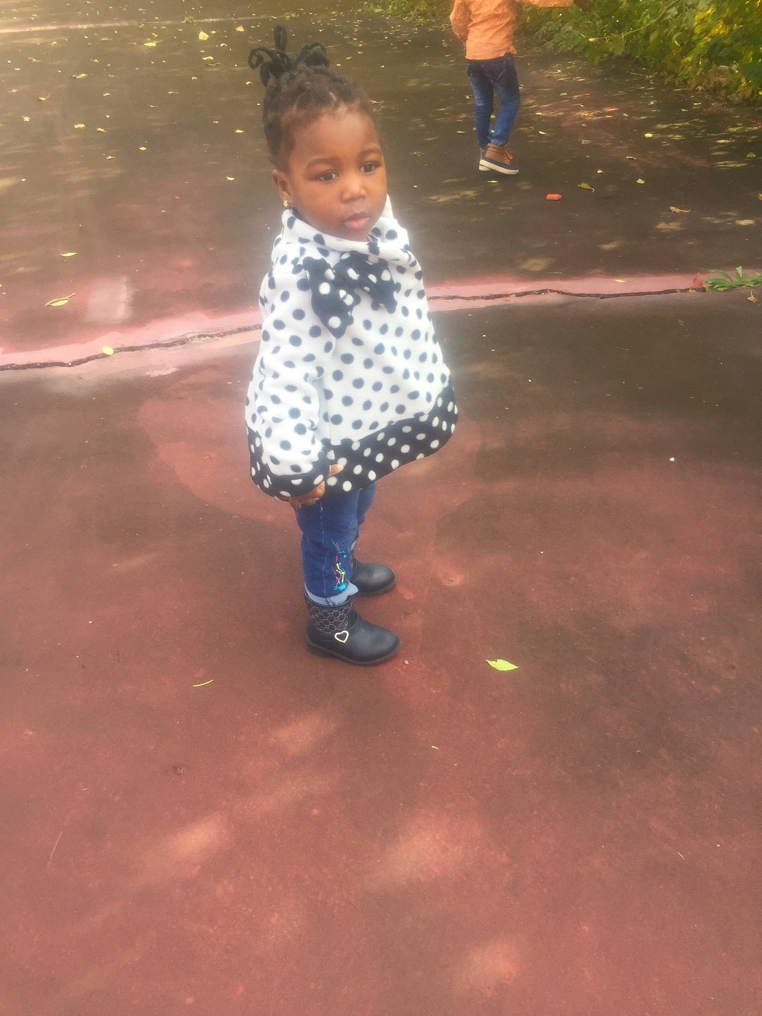 Chizaram is registered to the contest to win money with this photo: boy, child, cool, day, design, fun, girl, outerwear, pattern, person, pink, play, recreation, shoe, standing, toddler, trousers, vacation