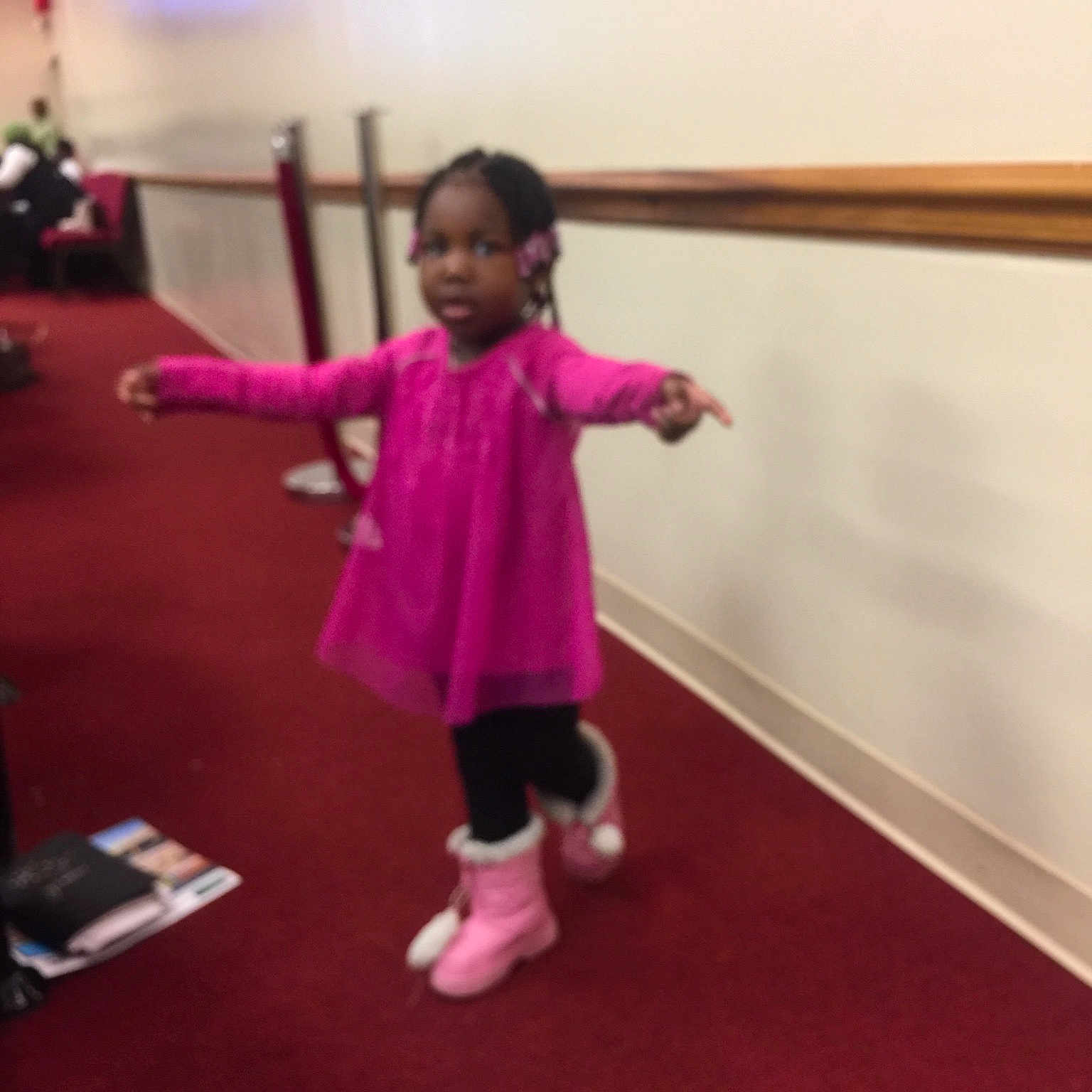 Chizaram is registered to the contest to win money with this photo: arm, child, clothing, day, flooring, footwear, fun, girl, human_body, joint, leg, magenta, person, physical_fitness, pink, red, room, shoe, shoulder, standing