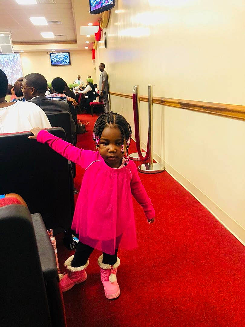 Chizaram joined the competition — help win amazing prizes! child, costume, day, flooring, fun, girl, person, pink, product, red, room, shoulder, smile, standing, toddler