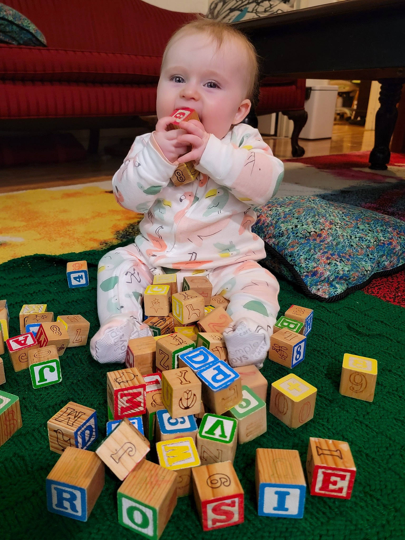 Rosabella is registered to the contest to win money with this photo: baby, baby_products, baby_toddler_clothing, child, comfort, couch, flooring, fun, green, indoor_games_and_sports, person, play, recreation, room, sharing, sitting, tabletop_game, television, toddler, toy