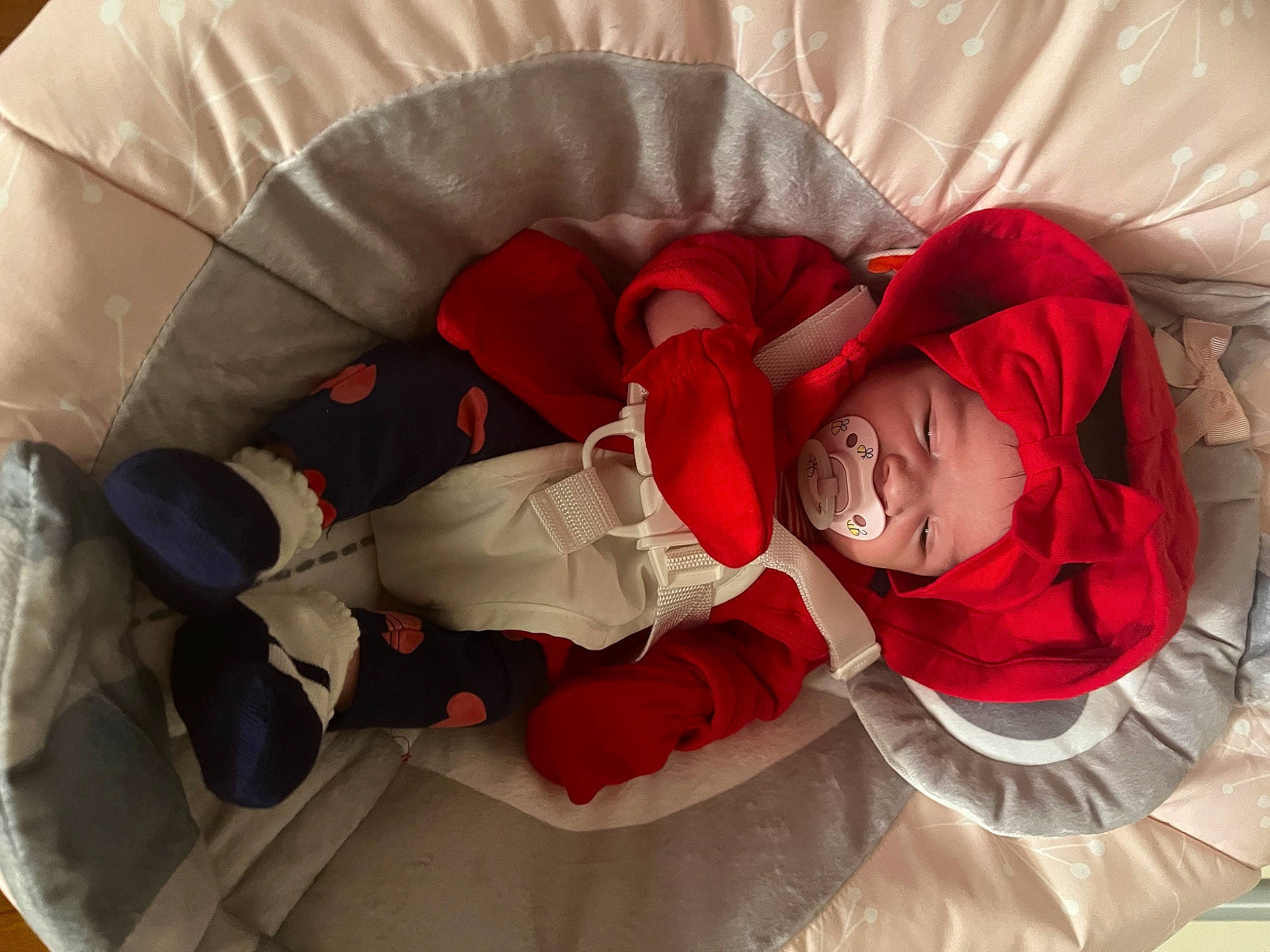 Hermione is registered to the contest to win money with this photo: baby, carmine, child, christmas, christmas_eve, comfort, event, fictional_character, happy, hat, headwear, human_leg, lap, linens, person, room, santa_claus, sitting, sleeve, smile