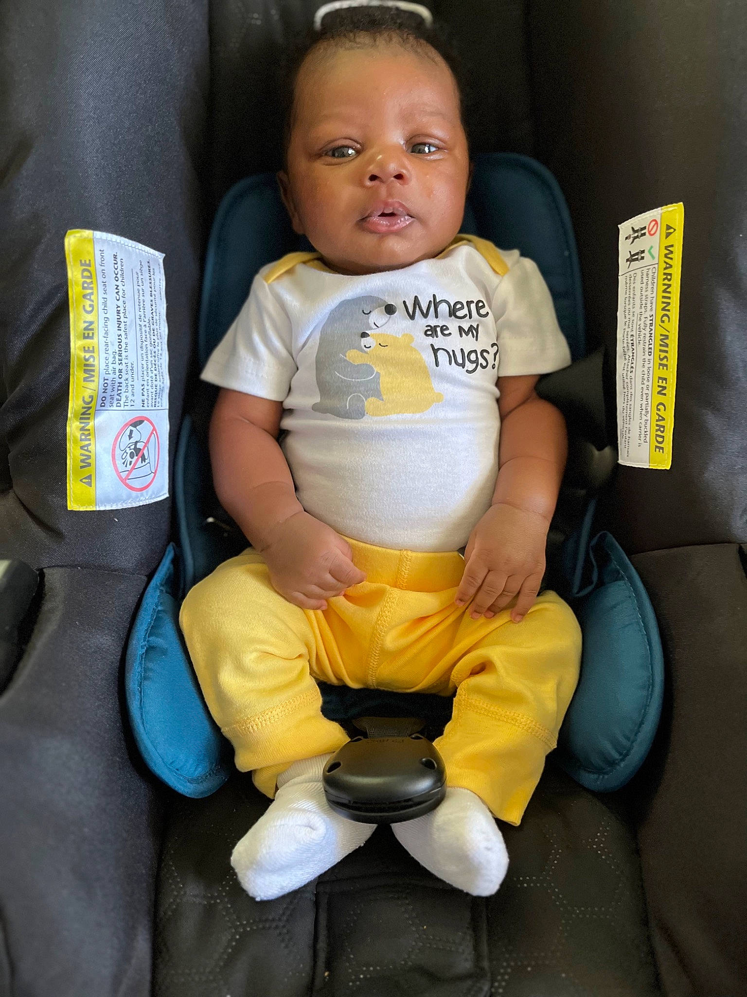 Kyson is registered to the contest to win money with this photo: baby, baby_toddler_clothing, chair, cheek, child, comfort, eye, finger, hairstyle, happy, head, human_body, human_leg, knee, lap, person, sitting, sleeve, t_shirt, thigh
