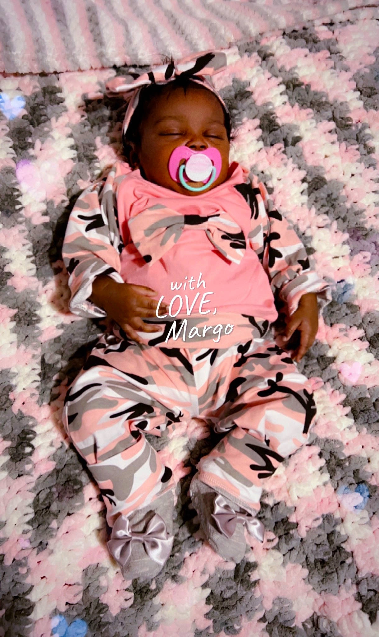 Logan joined the competition — help win amazing prizes! baby, baby_products, baby_toddler_clothing, child, comfort, face, fur, grass, happy, linens, magenta, pattern, peach, people_in_nature, person, pink, portrait_photography, sitting, sleeve, smile