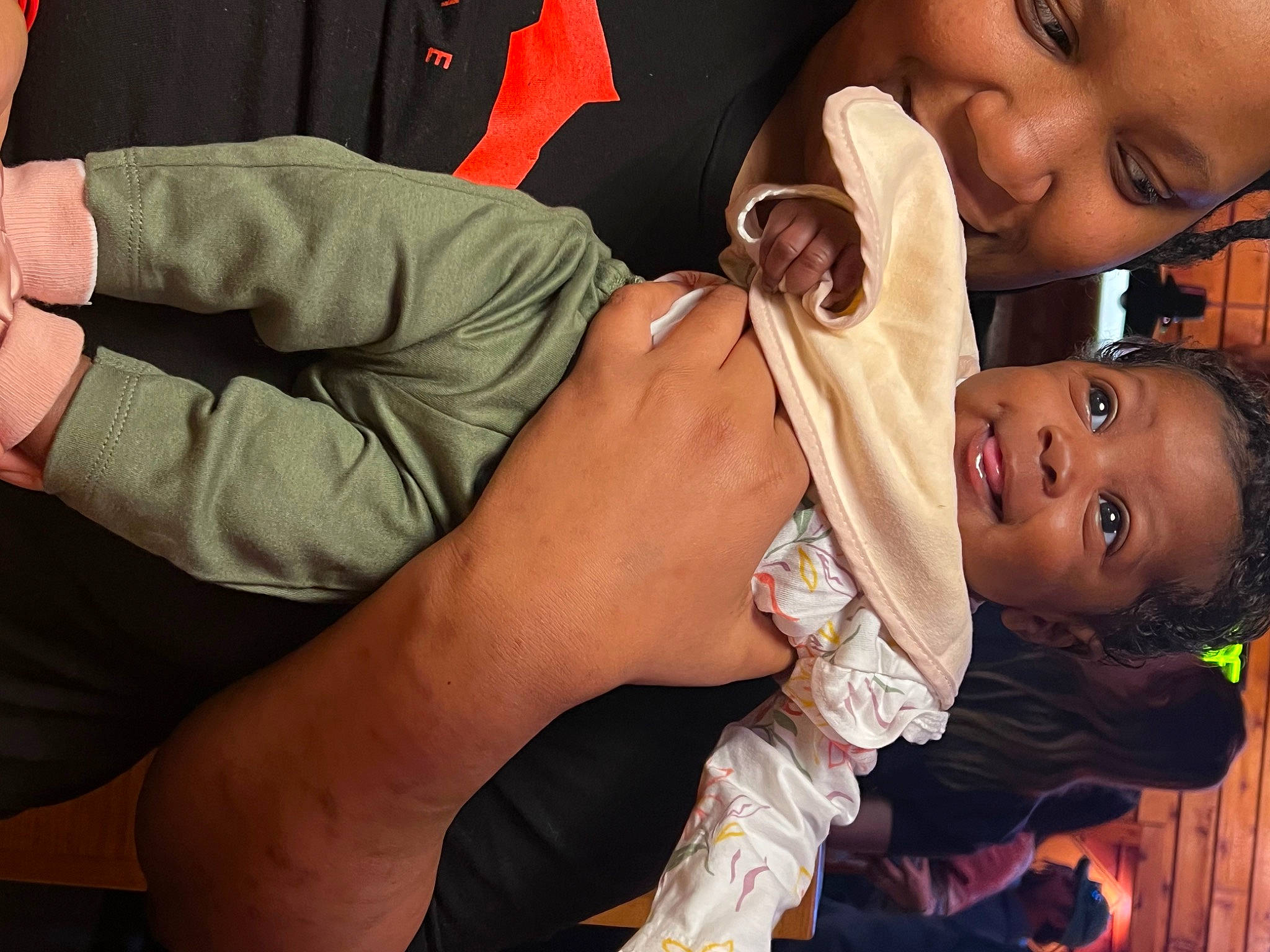 Logan is registered to the contest to win money with this photo: arm, baby, baby_toddler_clothing, child, ear, event, eyelash, finger, flash_photography, gesture, hand, happy, headwear, joy, lip, mouth, nail, nose, person, skin