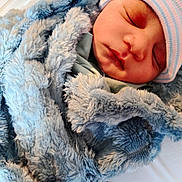 Jayceon joined the competition — help win amazing prizes! newborn, baby, sleeping, blanket, blue, hat, infant, cozy, soft, closeup, face, child, wrapped, warm, cute, portrait, toddler, peaceful, indoors, resting