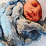 baby, blanket, blue, child, closeup, cozy, cute, face, hat, indoors, infant, newborn, peaceful, portrait, resting, sleeping, soft, toddler, warm, wrapped