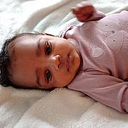 Olivia joined the competition — help win amazing prizes! baby, blanket, child, cozy, cute, eyes, face, fox_design, human, indoors, infant, laying_down, newborn, pink_clothing, portrait, relaxed, skin, sleepwear, soft_texture, young