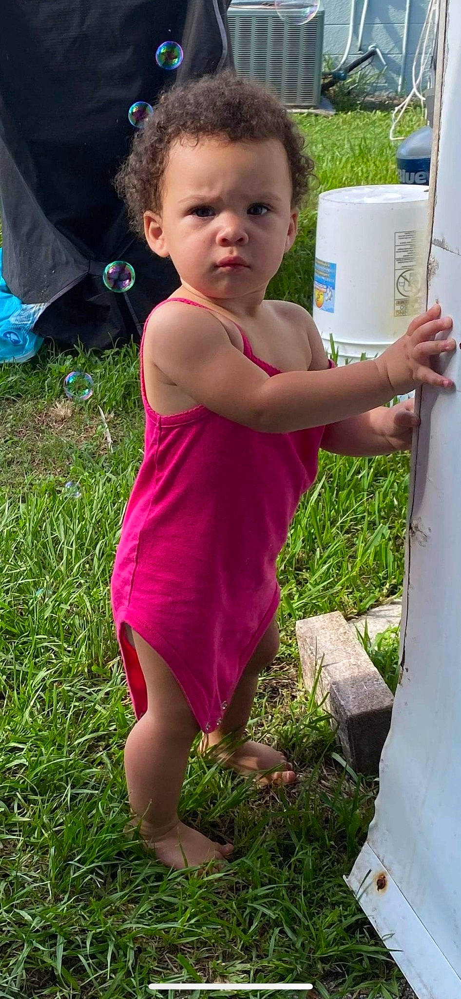 Ayana is registered to the contest to win money with this photo: barefoot, blue, calf, child, dress, foot, fun, grass, green, happy, human_leg, joint, leisure, magenta, people_in_nature, person, plant, spring, summer, thigh