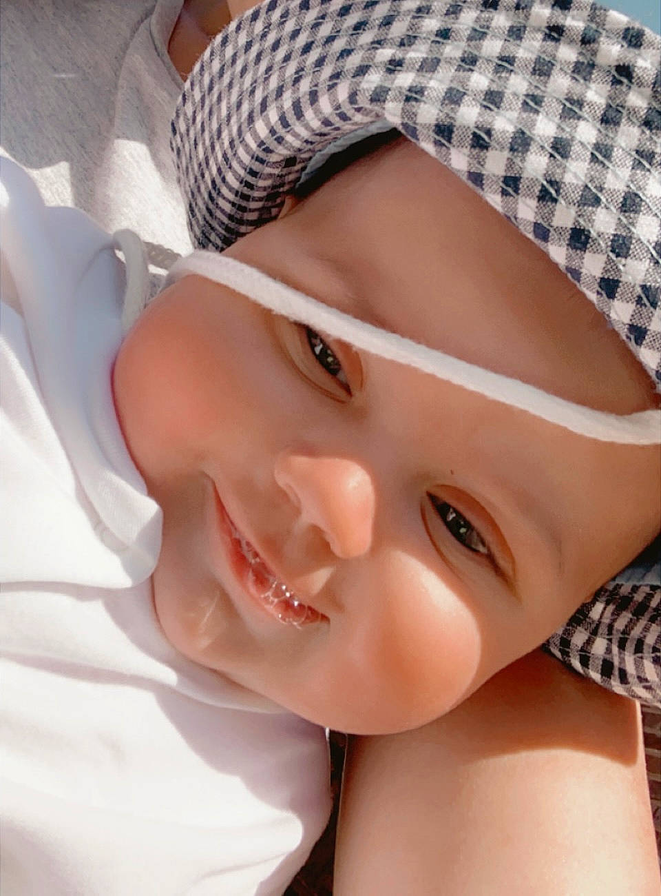 Harriet is registered to the contest to win money with this photo: baby, baby_toddler_clothing, cap, cheek, child, chin, eye, eyebrow, eyelash, face, happy, headgear, headwear, lip, mouth, neck, nose, person, skin, sleeve