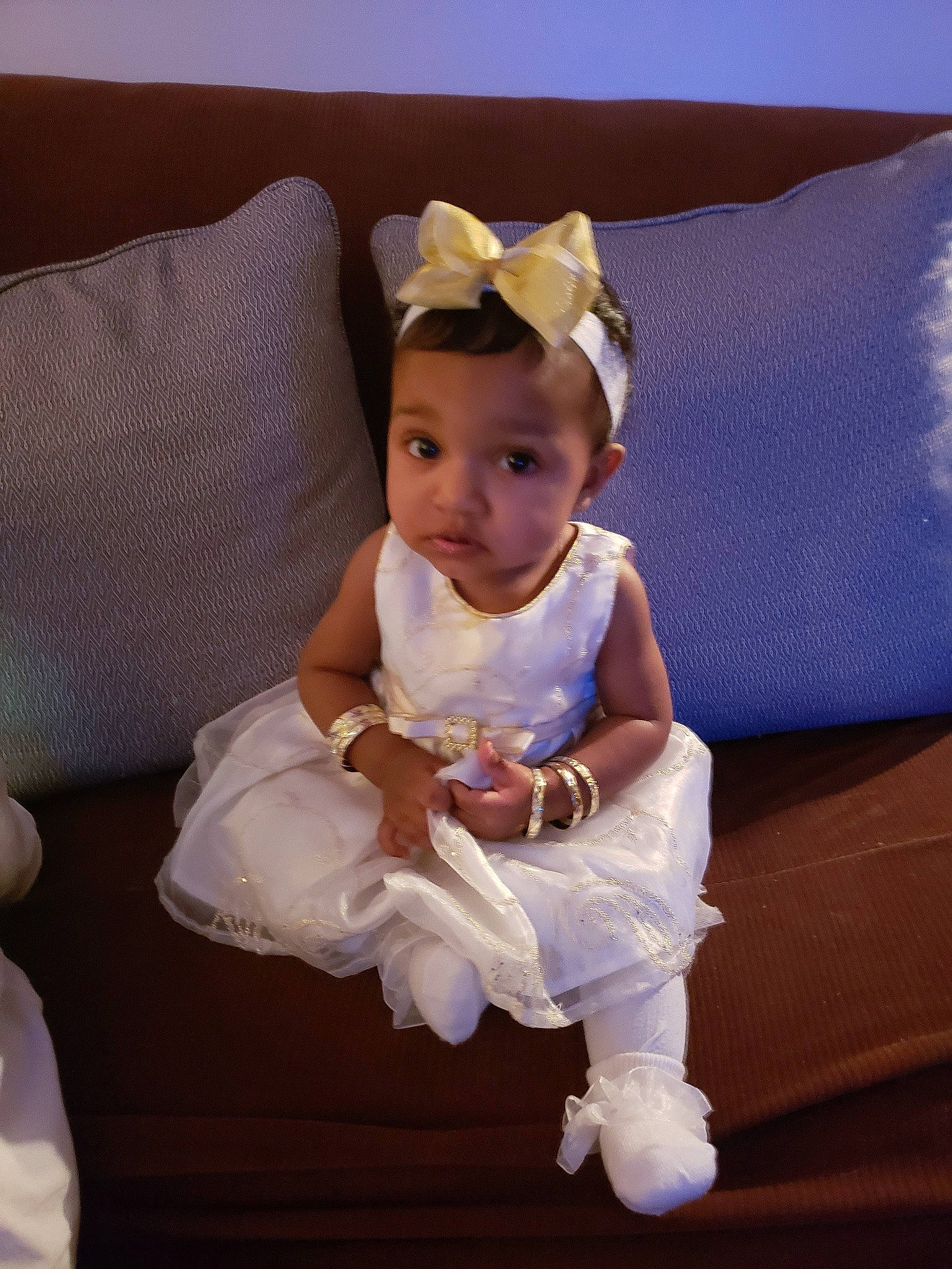 Mia joined the competition — help win amazing prizes! baby, baby_toddler_clothing, child, costume, dress, fun, hair_accessory, person, room, sitting, skin, smile, toddler, white