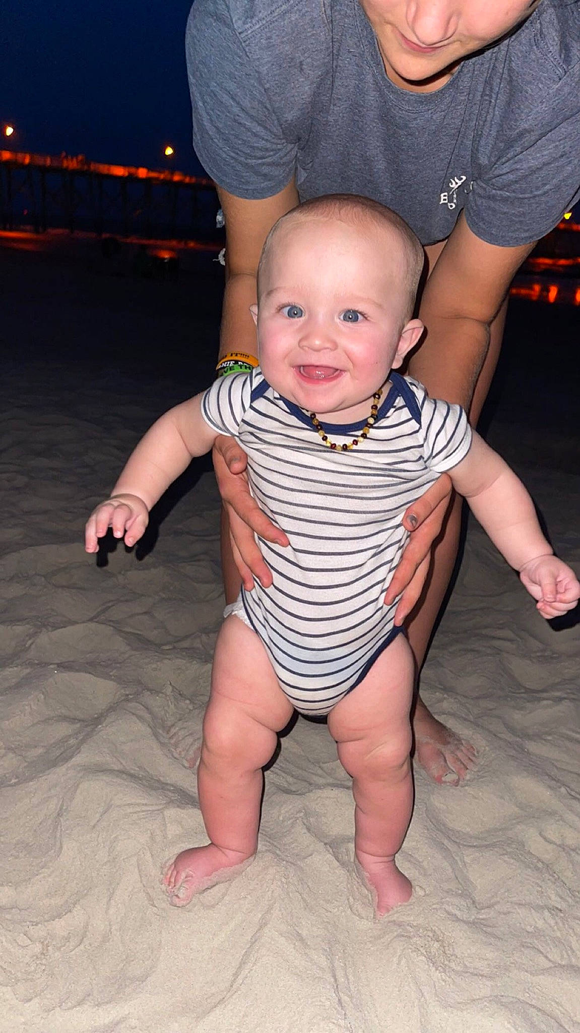 Hank is registered to the contest to win money with this photo: arm, baby, baby_toddler_clothing, blue, eye, finger, flash_photography, gesture, hand, happy, head, human_body, joint, joy, leg, muscle, person, skin, smile, standing